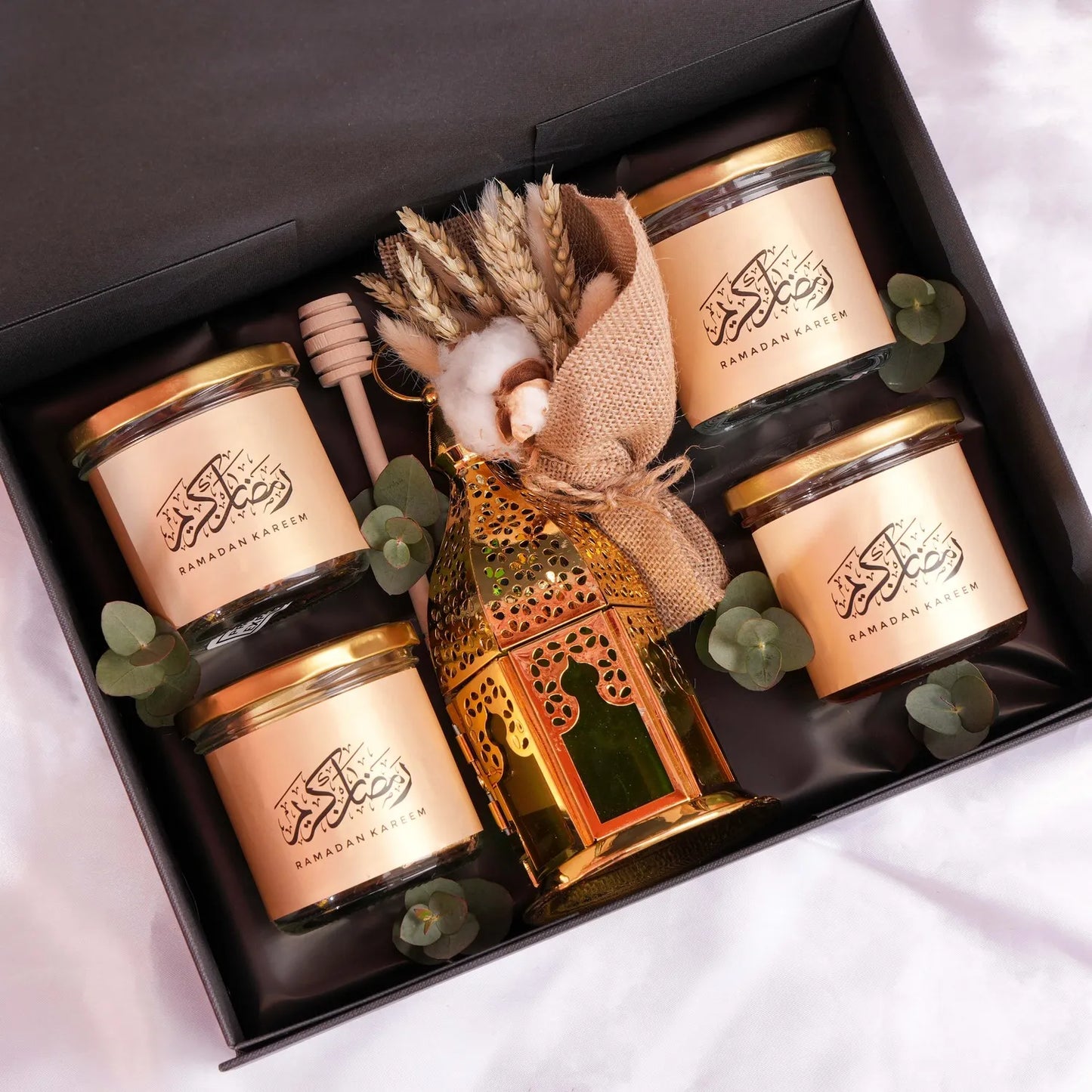 Special chocolate, nuts and honey box with golden lantern